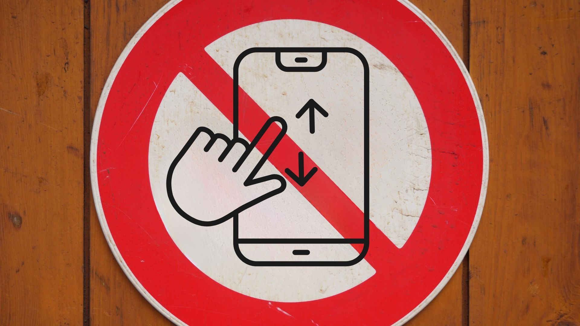 A warning sign on a wooden wall to stop scrolling on your phone and rather create fine art photographs