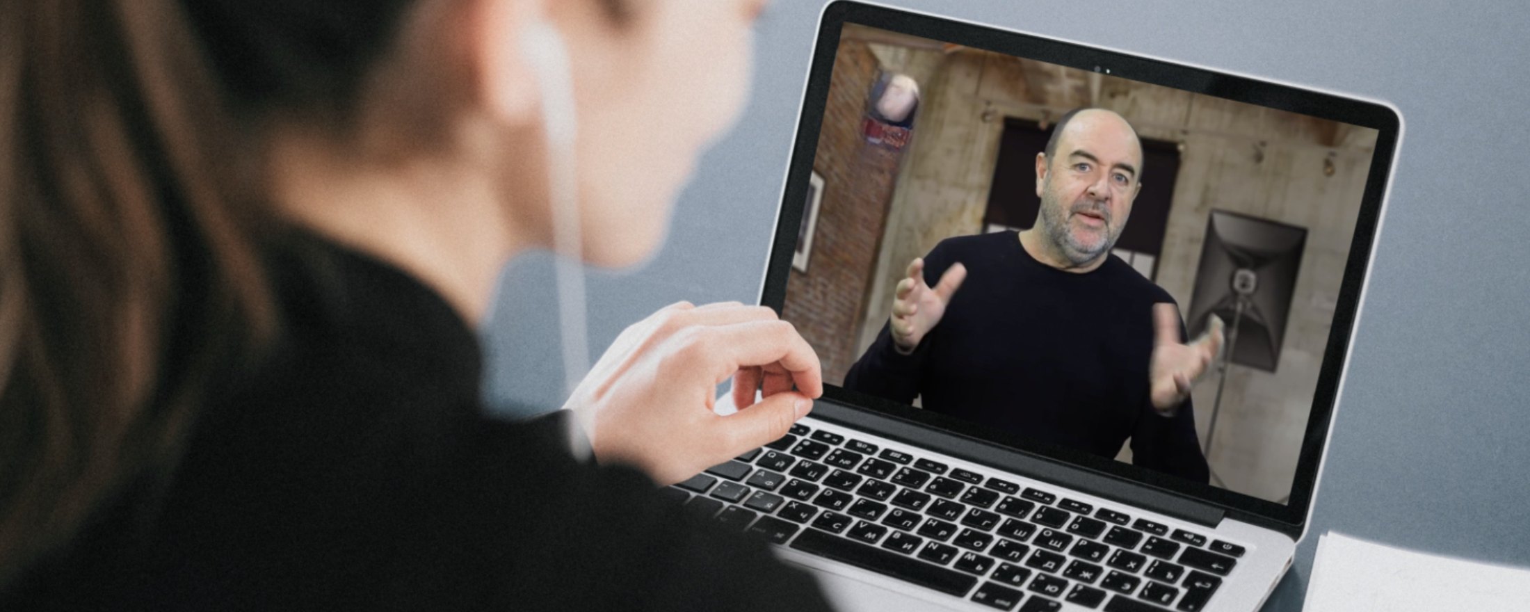 Student at a laptop watching Martin Osner teach a live Zoom class